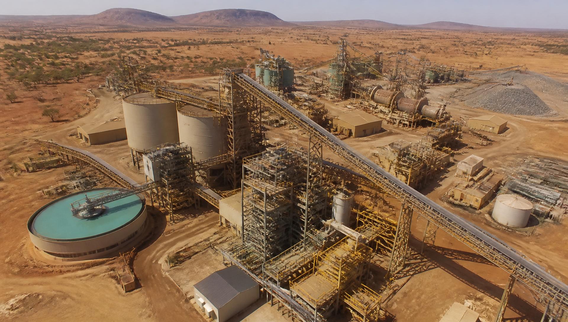 Aerial view of a modern mineral processing plant in an arid landscape